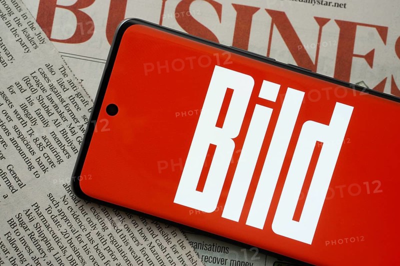 The logo of the German newspaper Bild is displayed on a smartphone screen