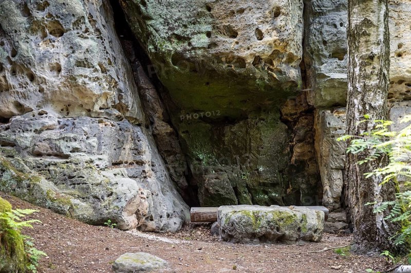 Bench with table in a small natural sandstone cave on the way to Kleiner Bärenstein, Saxon Switzerland, Saxony, Germany