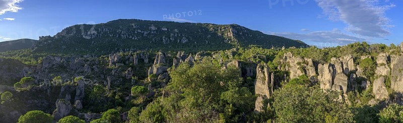 Panoramic view of the rocks in the evening light from the Belvedere, Mourèze, Département Hérault, France