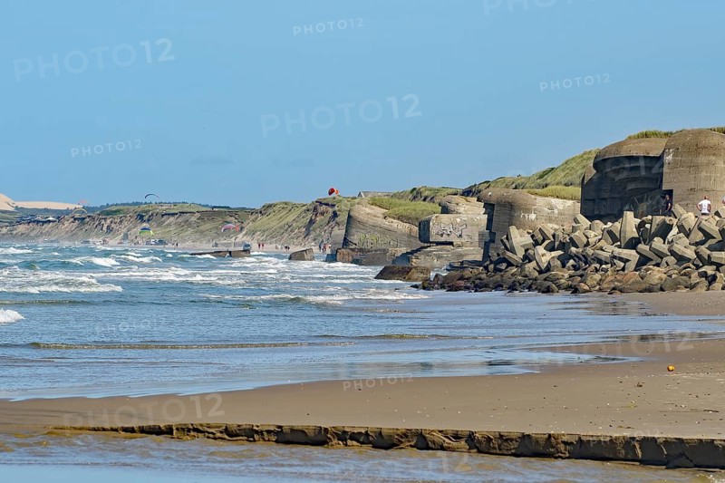 Concrete bunker on the beach with a view of the sea and the waves, bunker from the Second World War, Lokken, Nordjylland, Jutland, Denmark