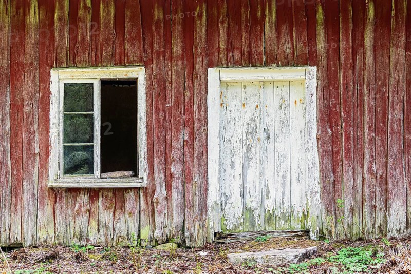 Old dilapidated abandoned wooden house with a broken window, Sweden