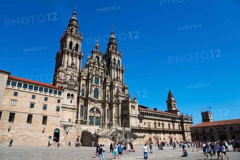 Majestic cathedral under a bright blue sky, many people in the foreground, cathedral, Santiago de Compostela, autonomous community of Galicia, place of pilgrimage, destination of the Way of St James, Spain