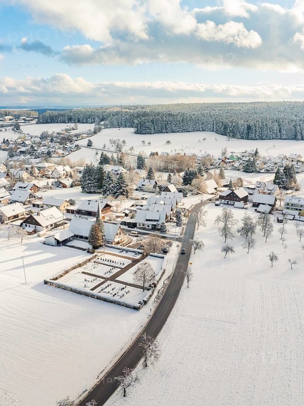 Rural winter landscape with snow-covered houses and streets, Oberreichenbach, Black Forest, Calw district, Germany