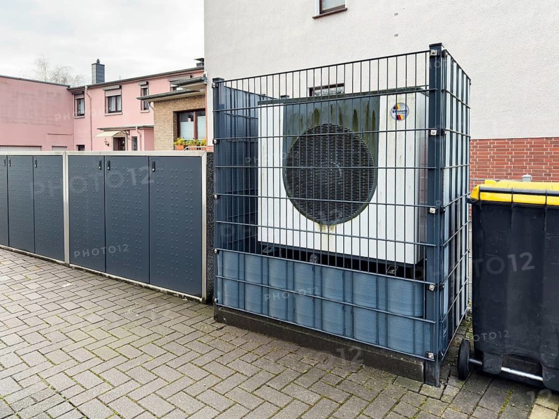 Heat pump behind a fence in Hilden, Germany