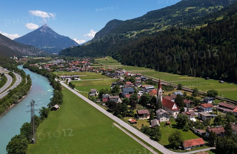 Drone shot, view of village with parish church, Schönwies, Inn, Oberinntal, Tyrol, Austria