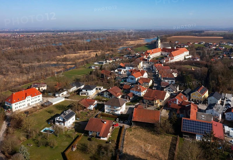 Drone shot, view of the village with Augustinian monastery Reichersberg, Reichersberg, Innviertel. Upper Austria, Austria