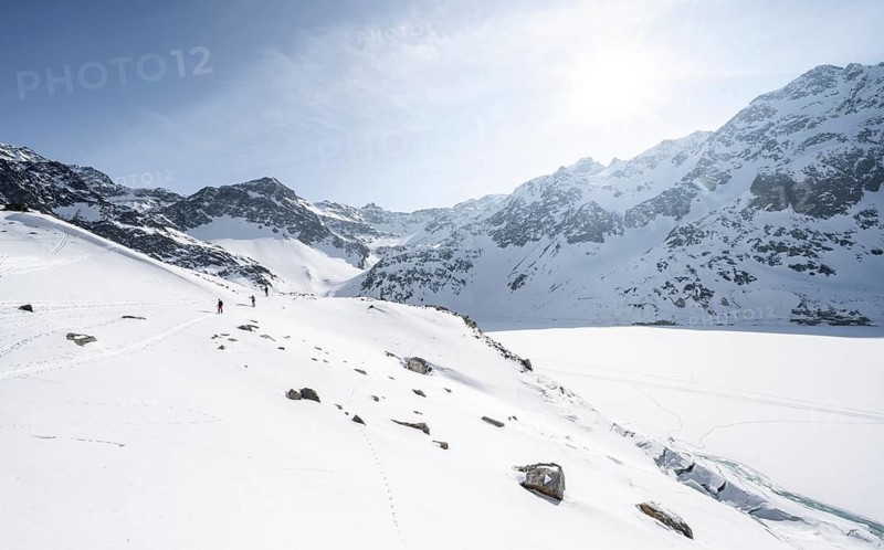 Ski tourers at the reservoir, Finstertal reservoir, ascent to Sulzkogel, Kühtai, Stubai Alps, Tyrol, Austria