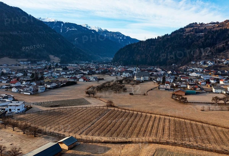 Drone shot, view of village with parish church, Prutz, Kaunertal, Inntal, Tyrol, Austria