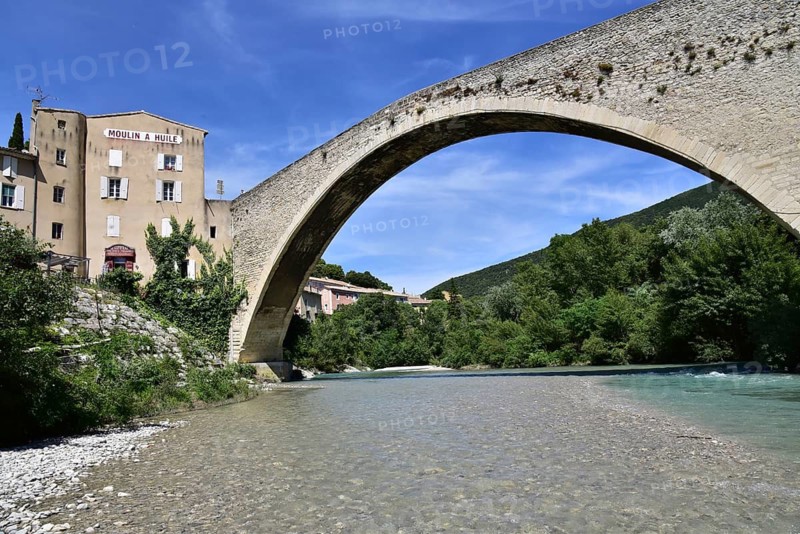 The Pont de Nyons, medieval stone arch bridge over the river Eygues in the municipality of Nyons in the Auvergne-Rhône-Alpes region in the south of France