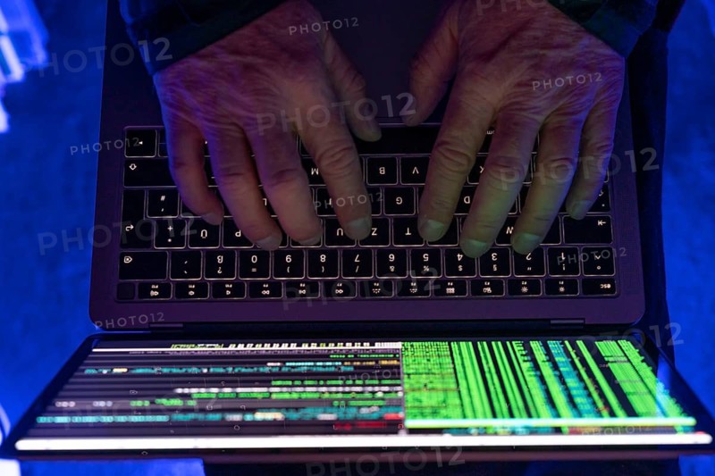 Symbolic image cyber attack, computer crime, cybercrime, computer hackers attack a network, computer, IT infrastructure