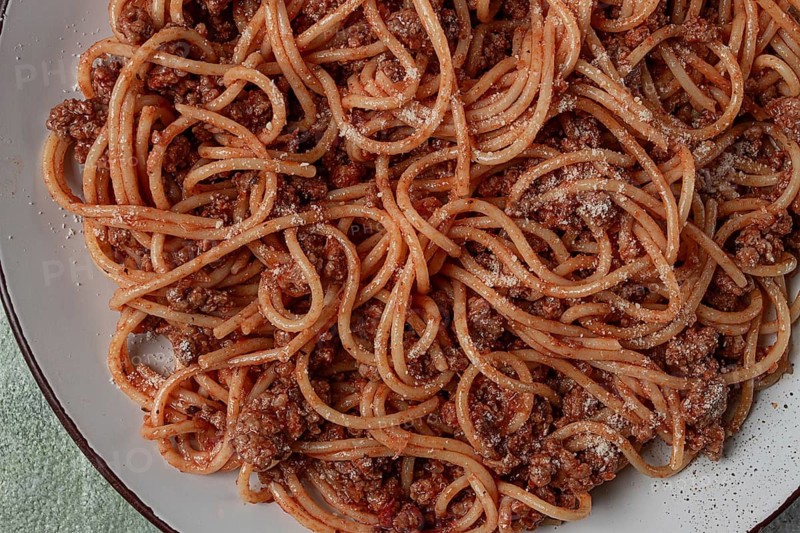 Spaghetti bolognese, in a frying pan, top view, homemade, no people