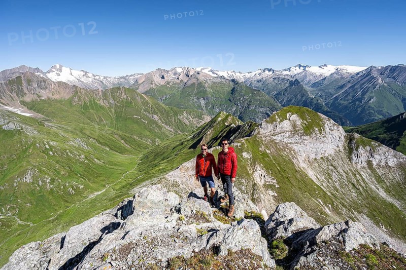 Two friends, mountaineers in front of a mountain panorama with Großvenediger, mountain landscape with mountain peaks of the Venediger group, view from the summit of the Gösleswand, Lasörling group, Hohe Tauern National Park, East Tyrol, Tyrol, Austria