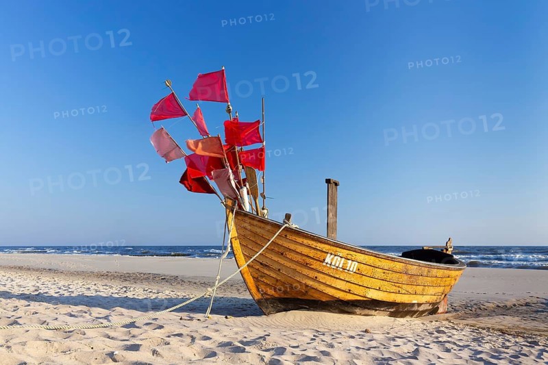 Traditional wooden fishing boat on the beach along the Baltic Sea at Stubbenfelde, Loddin on the island Usedom, Mecklenburg–Western Pomerania, Germany