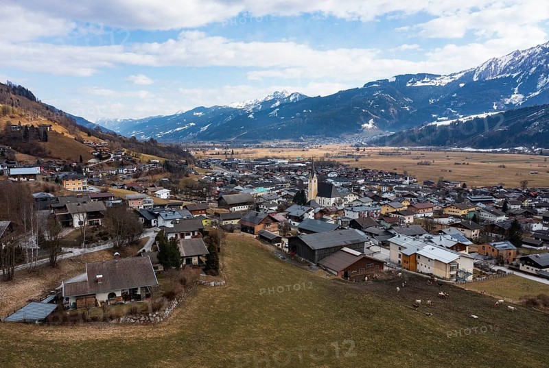 Drone shot, view of village with parish church, Piesendorf, Pinzgau, Salzburg province, Austria