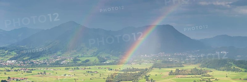 Panorama from the Grünten over the Illertal with rainbow to Blaichach and Immenstadt, behind Steineberg, 1660m and Mittagberg, 1451m, Allgäu Alps, Allgäu, Bavaria, Germany