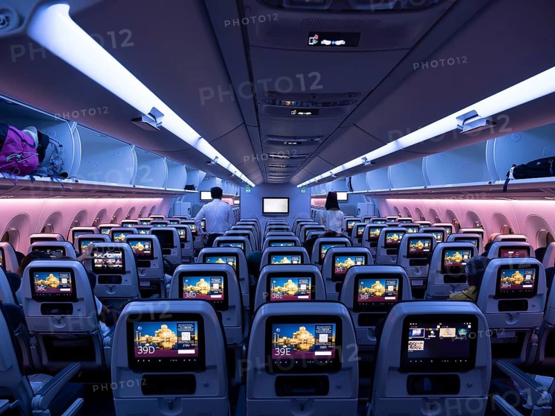 Aircraft interior, empty cabin, seats with screens, Qatar Airways