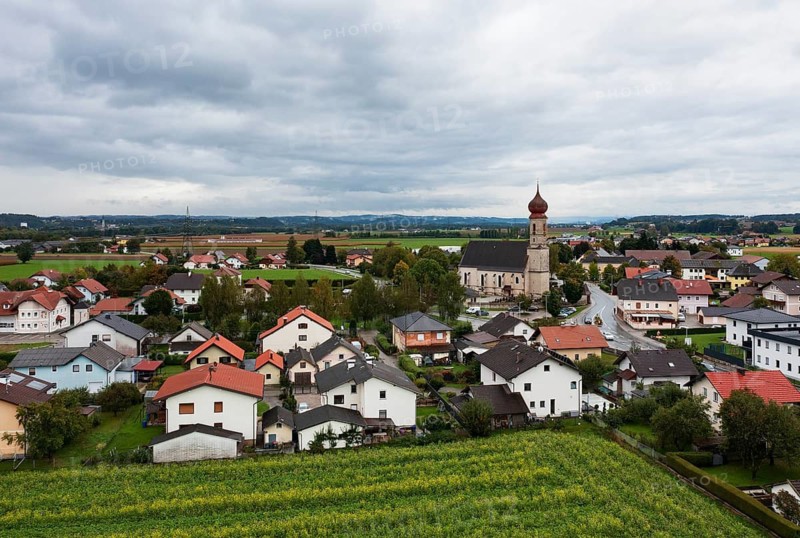 Drone shot, view of village with church, Burgkirchen, Innviertel, Upper Austria, Austria