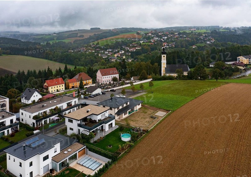 Drone image, residential buildings, view of village with church, Brunnenthal, Innviertel, Upper Austria, Austria