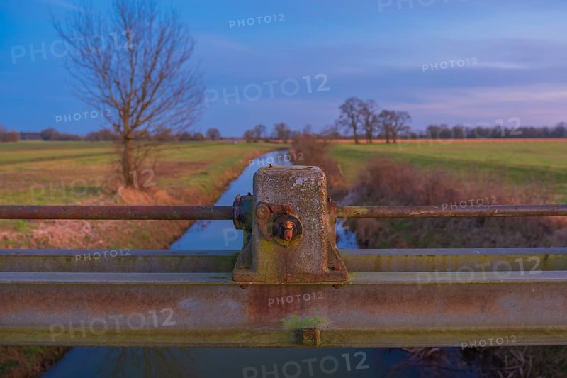 Detailed view of a part of a sluice with a ditch behind it in the evening light, Kirchlinteln, Verden, Aller Leine Valley, Lower Saxony, Germany