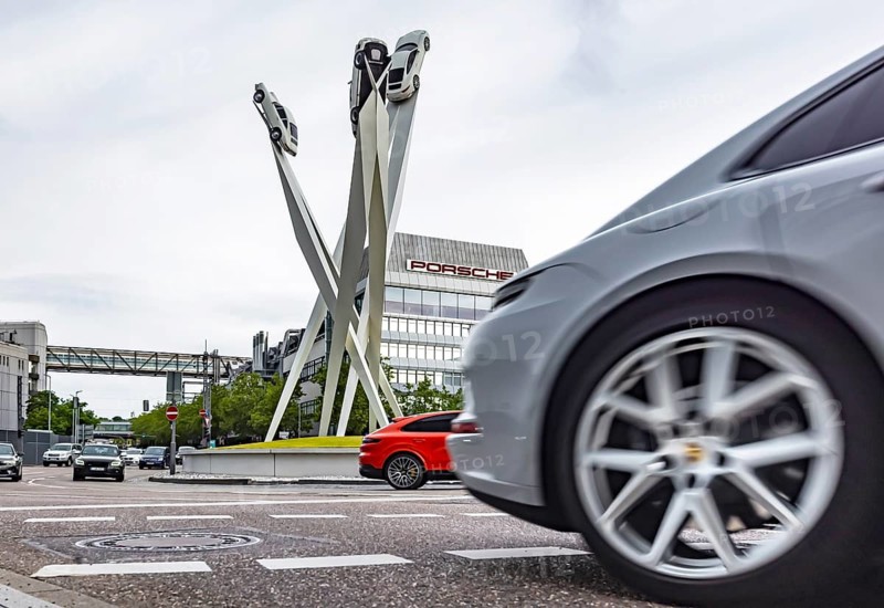 Porscheplatz Zuffenhausen with Porsche headquarters. Artwork Inspiration 911 by Gerry Judah with three steles, each presenting a Porsche 911. Stuttgart, Baden-Württemberg, Germany