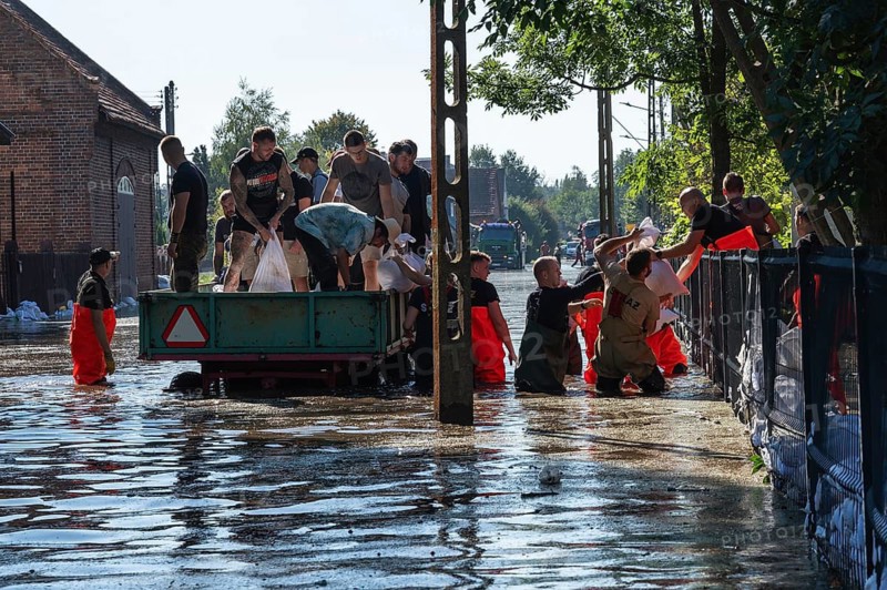 SCINAWA. POLAND - SEPTEMBER 21, 2024: Flood caused by heavy rainfall and river overflowing. Residents help their neighbors.
