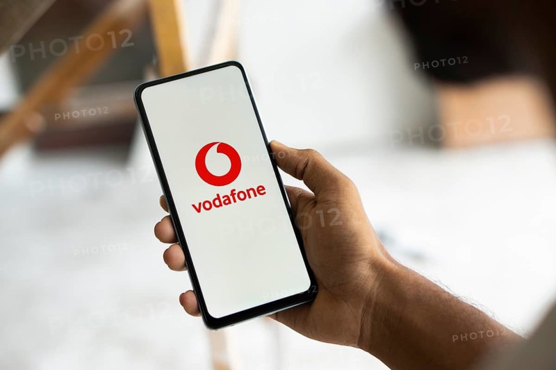 Vodafone logo is displayed on smartphone.