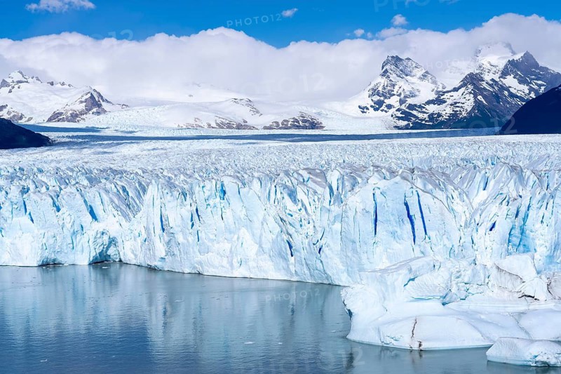 Perito Moreno glacier, breakaway with shimmering blue ice crevices on Lake Argentino, snow-capped Andes in the background, Los Glaciares National Park, Santa Cruz Province, Patagonia, Argentina