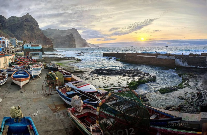 Harbour view with traditional fishing boats and sunset over the sea, romantic harbor scene, Ponta do Sol, Santo Antao, Cabo Verde, Cape Verde, Cape Verde