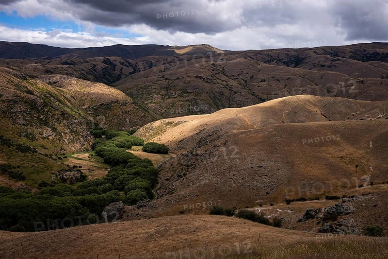 Landscape in New Zealand. View from Lindis Pass Tarras Road towards Cluden Creek Road. Lindis Valley, Otago, South Island, New Zealand