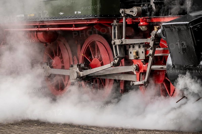 Detailed view of the drive wheels and coupling rods of a steam locomotive, Bochum railway museum, museum days weekend, with many attractions such as steam locomotive rides, 3 locomotives are under steam, historic trains make round trips through the Ruhr Valley, many locomotives can be visited, on the site of the former Dahlhausen railway depot, North Rhine-Westphalia, Germany