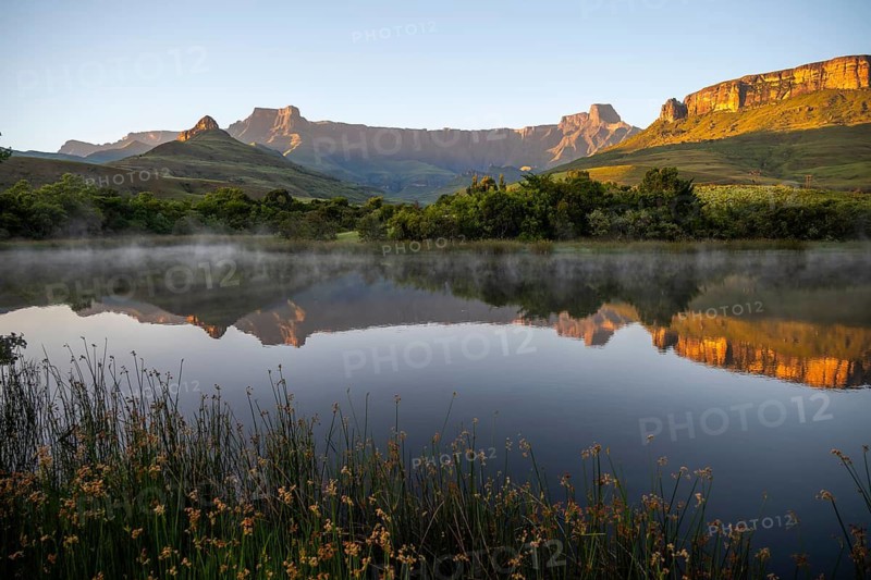 Sunrise, amphitheatre with reflection in the lake, Royal Natal National Park, Drakensberg Mountains south, Kwa Zulu Natal, South Africa