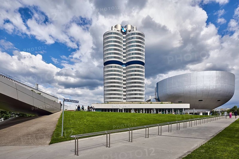 BMW museum, car museum, BMW corporate headquarters, high-rise building, modern architecture, commercial building, architect Karl Schwanzer, BMW four-cylinder, BMW tower, BMW high-rise building, sidewalk, metal railing, meadow, blue sky, white and dark gray cumulus clouds, Am Olympiapark, Munich, state capital, district-free city, Bavaria, Germany