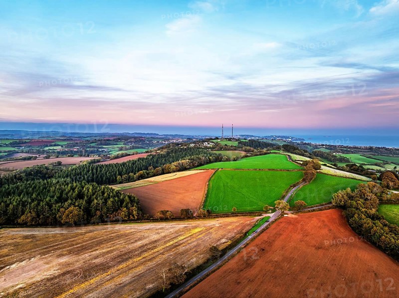 Sunset of Devon Farms and Fields over Berry Pomeroy from a drone, Totnes, England, United Kingdom