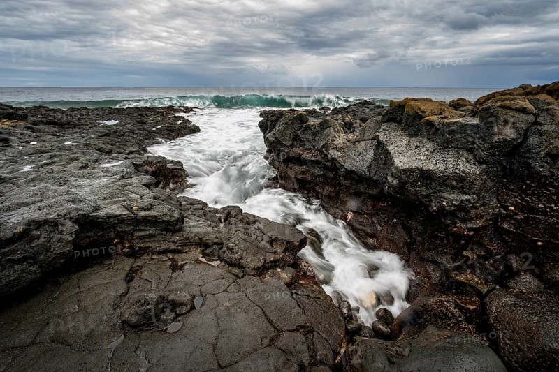 Waves blaze on the coast, rocky coast with volcanic stones, long exposure, Playa de la Pequeña, Punta Usaje, Lanzarote, Canary Islands, Spain