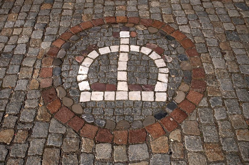 Motif of a crown in street pavement, paving stones, old town, Wangen im Allgäu, Bavaria, Germany