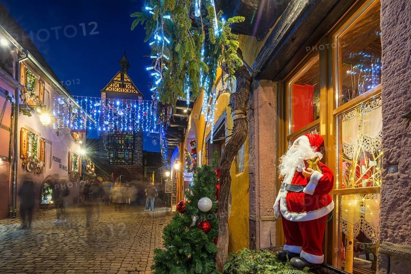 Colour-illuminated and Christmassy decorated half-timbered houses, blue hour, Christmas market, Riquewihr, Grand Est, Haut-Rhin, Alsace, France