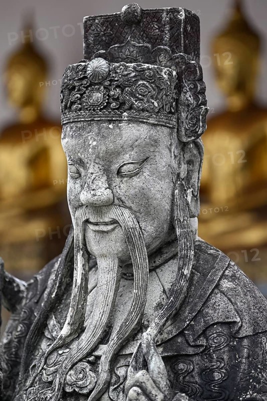 Stone statue of a Chinese warrior, guardian, Wat Pho, Temple of the Reclining Buddha, Bangkok, Thailand