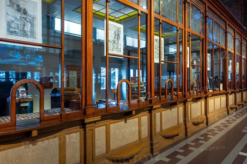 Former ticket hall with ticket counters and offices of the Schaerbeek railway station at Train World, railway museum in Schaarbeek, Brussels, Belgium