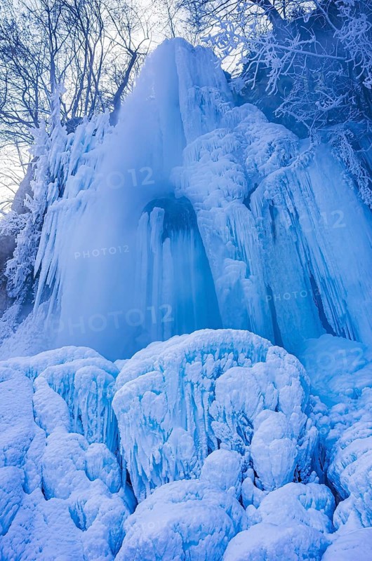 Urach waterfall full of bizarre ice formations frozen at winter temperatures, Bad Urach, Swabian Jura, Baden-Württemberg, Germany