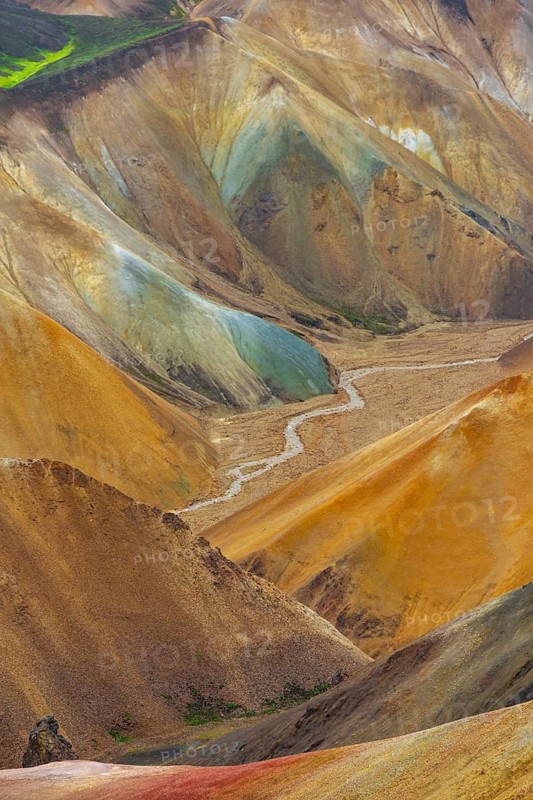 Small river between colourful rhyolite mountains, volcanic landscape, erosion landscape, view from Brennisteinsalda Landmannalaugar, Fjallabak Nature Reserve, Icelandic Highlands, Suðurland, Iceland