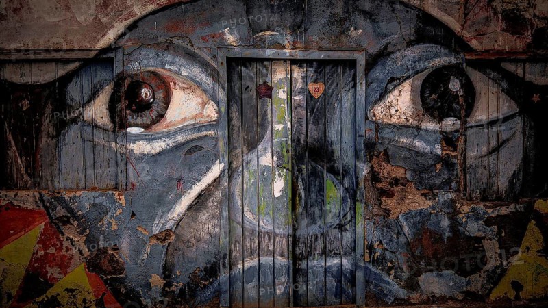 Wall painting on façade and door, graffiti, mural of a face with big eyes, Ponta do Sol, Santo Antao, Cabo Verde, Cape Verde