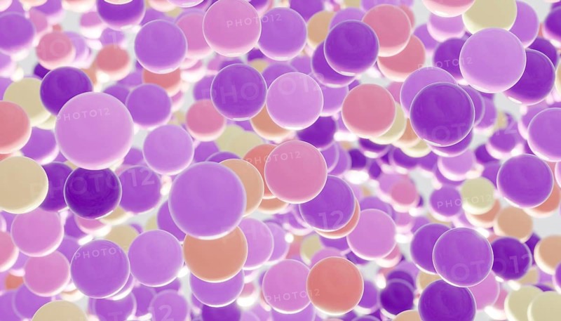 A whimsical scene of floating, colorful balls in shades of purple, pink, and yellow. The lively arrangement creates a dreamy and playful atmosphere, invoking joy and imagination