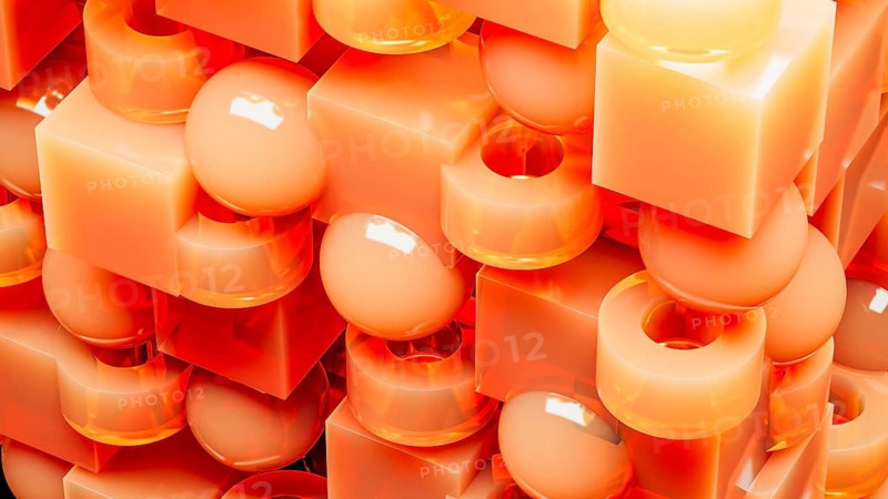 An engaging array of 3D geometric shapes in fiery orange tones combines spheres and cubes, creating a dynamic and visually stimulating design