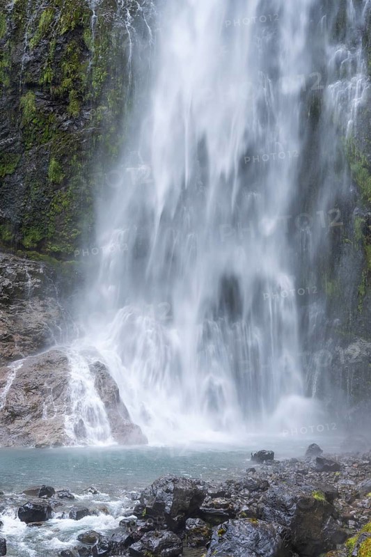 The Devils Punchbowl waterfall falls down a rock face. Arthurs Pass National Park, Canterbury South Island, New Zealand