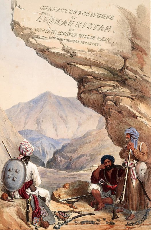 Three men with musical instruments rest under a rock in the mountainous landscape