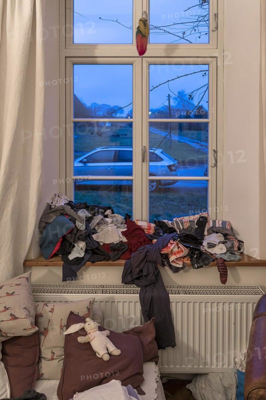 Unironed laundry on the windowsill in the living room, Mecklenburg-Vorpommern, Germany