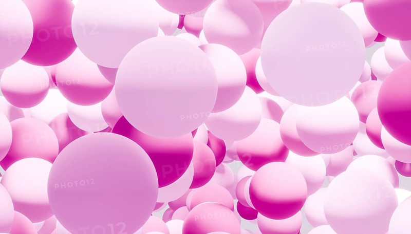 This image features a seamless pattern of overlapping 3D rendered spheres in varying shades of purple and pink, creating a visually captivating and modern abstract background