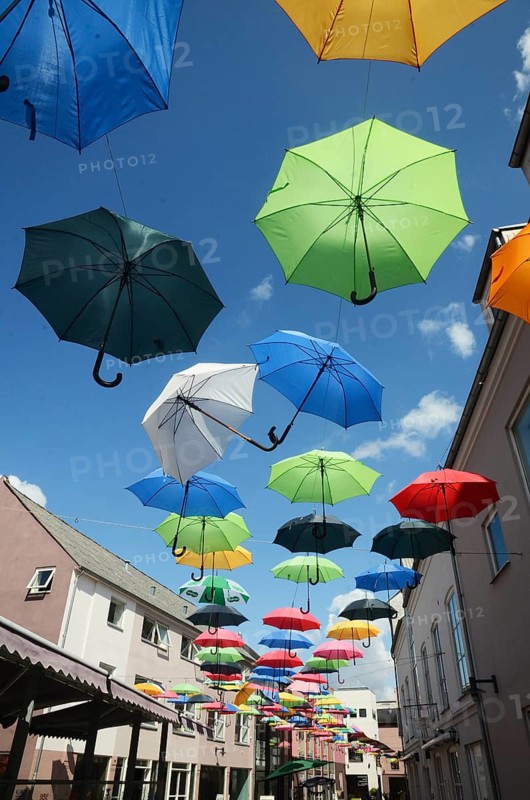 Many umbrellas hang over the street in Vejle, Jutland, Denmark, Scandinavia
