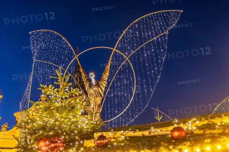 Baroque Christmas market with illuminated angels between the Protestant City Church and the Catholic Church of the Most Holy Trinity. Sights on the market square in the evening. Ludwigsburg, Baden-Württemberg, Germany