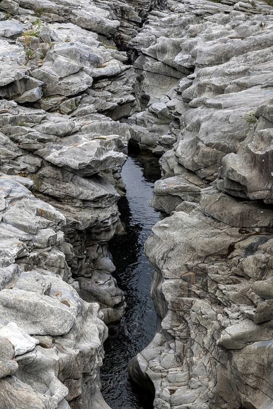Rocks, granite rock formations in the Maggia River near Ponte Brolla, in the Maggia Valley, Valle Maggia, Canton Ticino, Switzerland